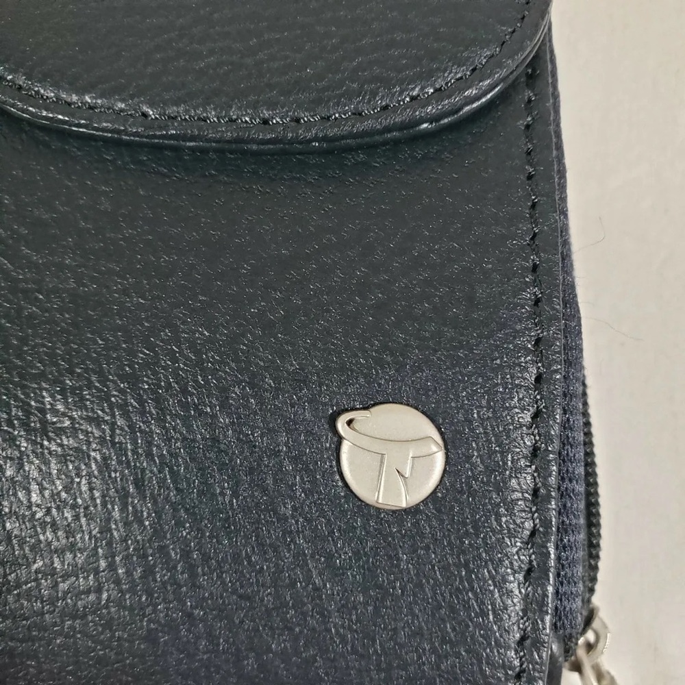 Black Wallet With Strap I believe is  Travel On Phone Case